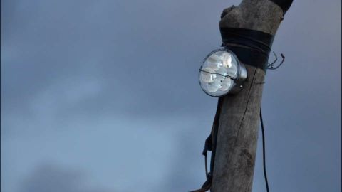Dubbed "Lion Lights," the lights are connected to a box with switches and to an old car battery powered by a solar panel. They were also devised to flash in sequence, tricking the lions into believing that someone is moving around carrying a flashlight.