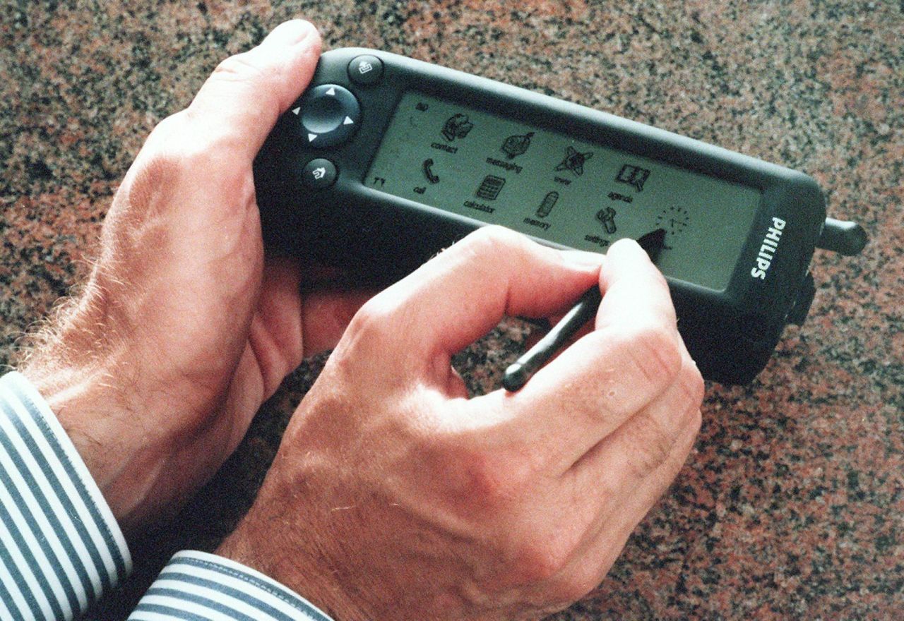 Philips demonstrates its new digital phone, The Synergy, in 1997 at a press conference in Dubai. The then-advanced device offered wireless access to e-mail, Internet and faxes.