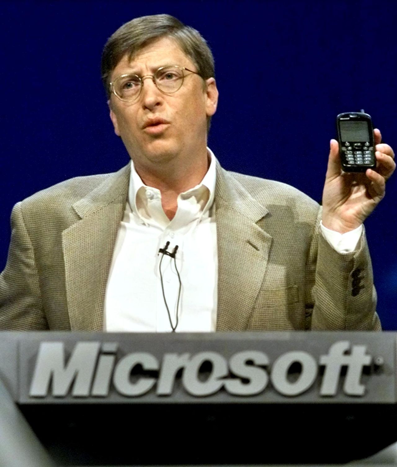 Even Microsoft chairman Bill Gates was not immune from holding ugly phones. Here he makes a point with a "new generation" cellphone during his annual "state of the industry" speech at the COMDEX convention in Las Vegas in November 2000.
