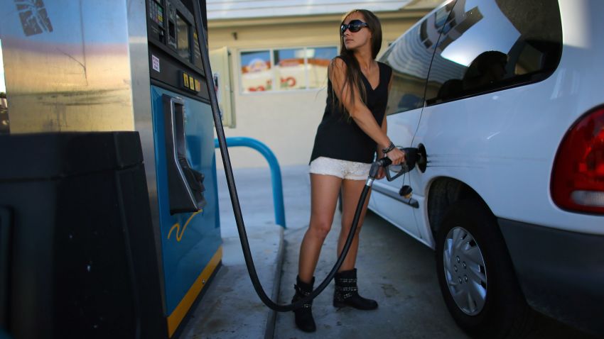 Carolina Villar pumps gas on February 4, 2013 in Miami, Florida. Reports indicate that gas pump prices are at their highest level on record for this period of the year and may be an indication that the year ahead may see even higher records. 