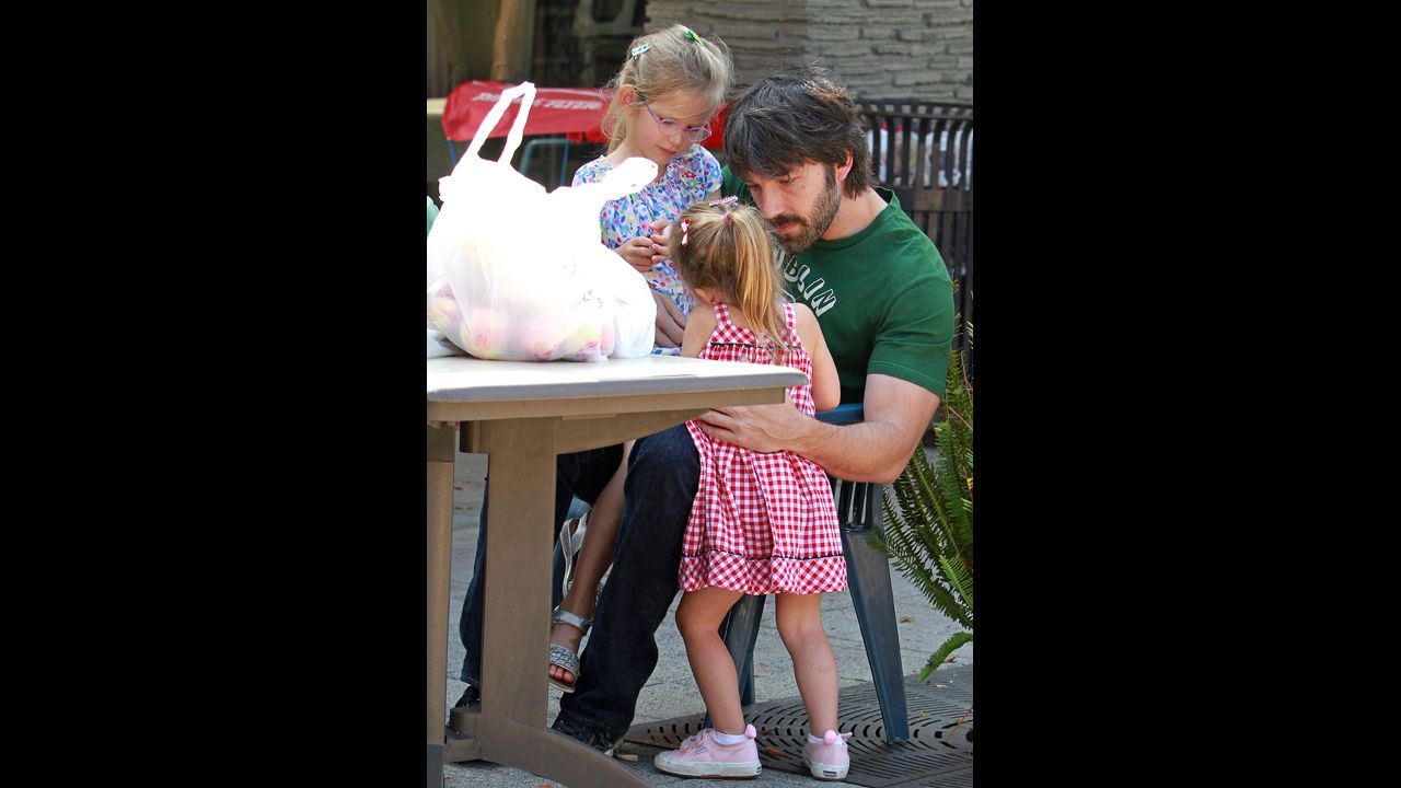 Ben Affleck takes his daughters Violet and Seraphina, born in 2009, to the Brentwood Farmers Market in Los Angeles.