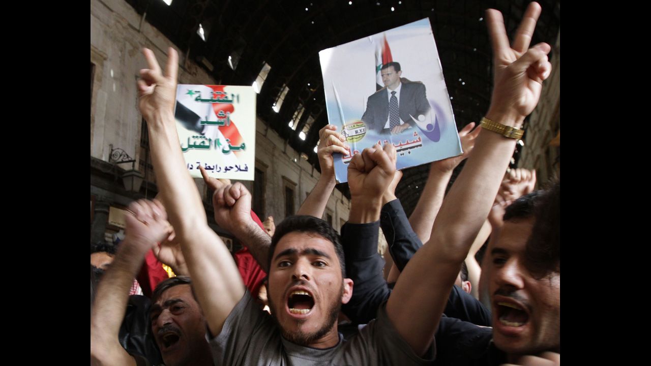 Syrians rally to show their support for President Bashar al-Assad in Damascus on April 30, 2011.