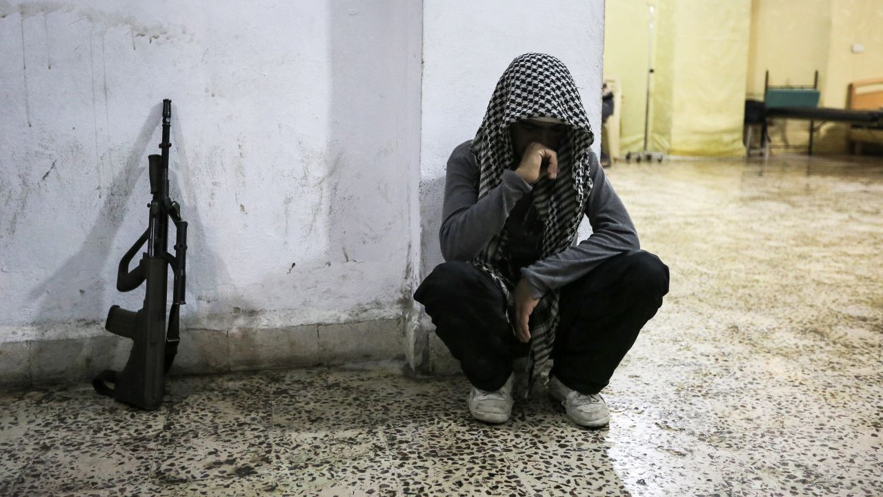 A Syrian rebel mourns the death of a comrade in Maraat al-Numan on November 20.