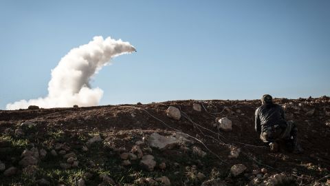 Syrian rebels launch a missile near the Abu Baker brigade in Albab on January 16.