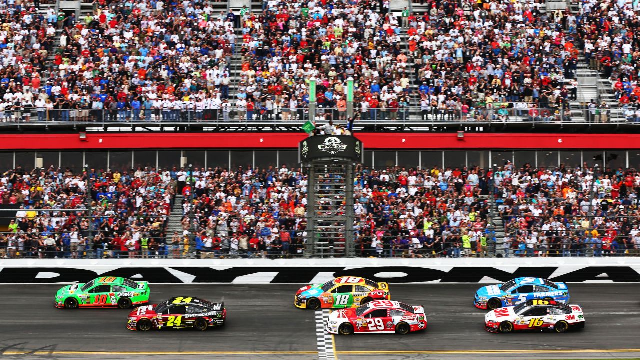 Danica Patrick, far left, leads the field past the green flag to start the Daytona 500.