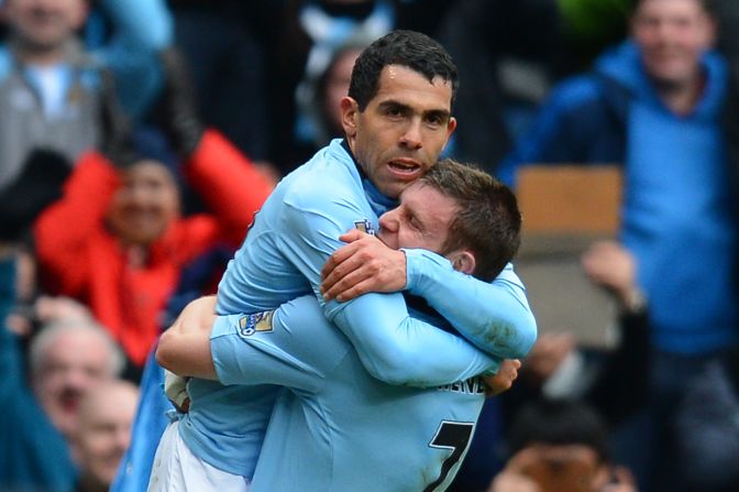 Carlos Tevez is hugged by James Milner after the Argentina star scored Manchester City's second goal against Chelsea in the 2-0 win.