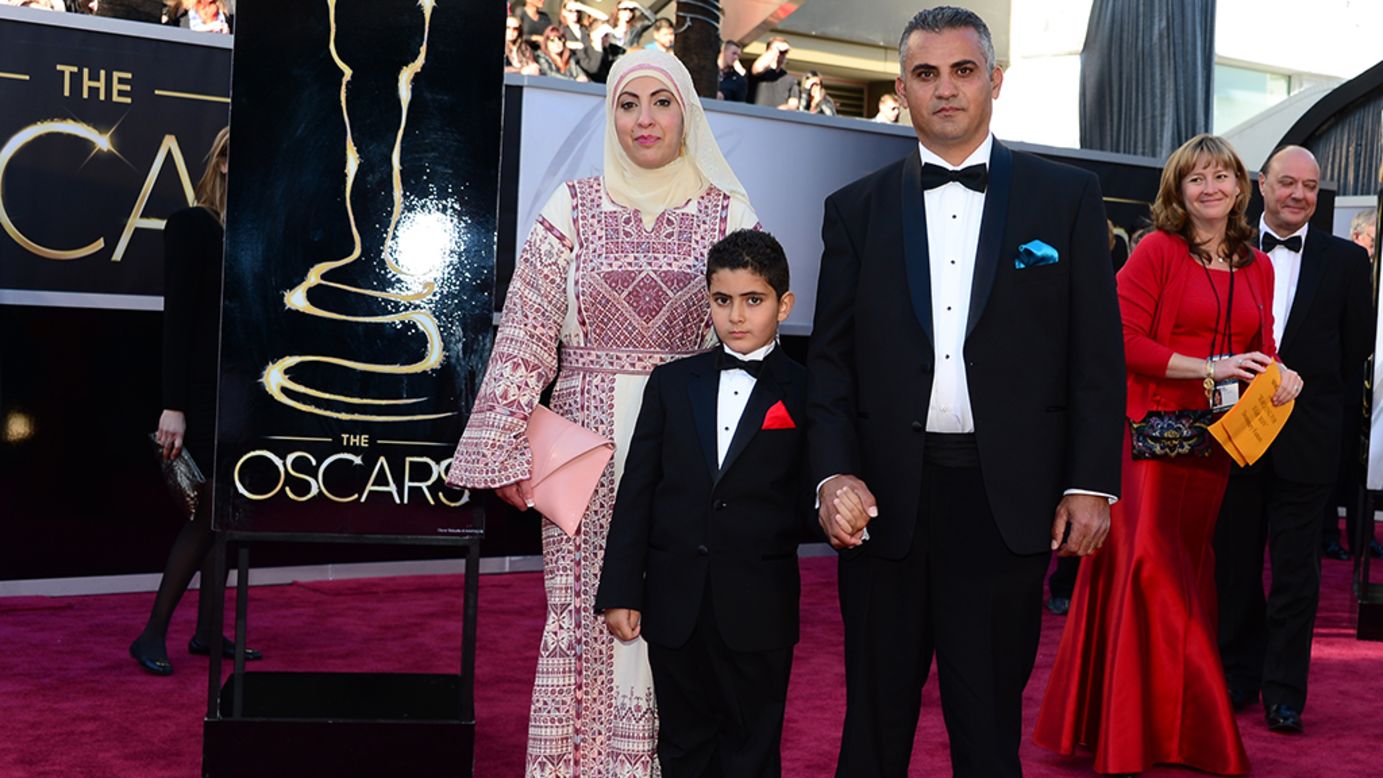 Best Documentary Feature nominee Emad Burnat, right, his wife and son