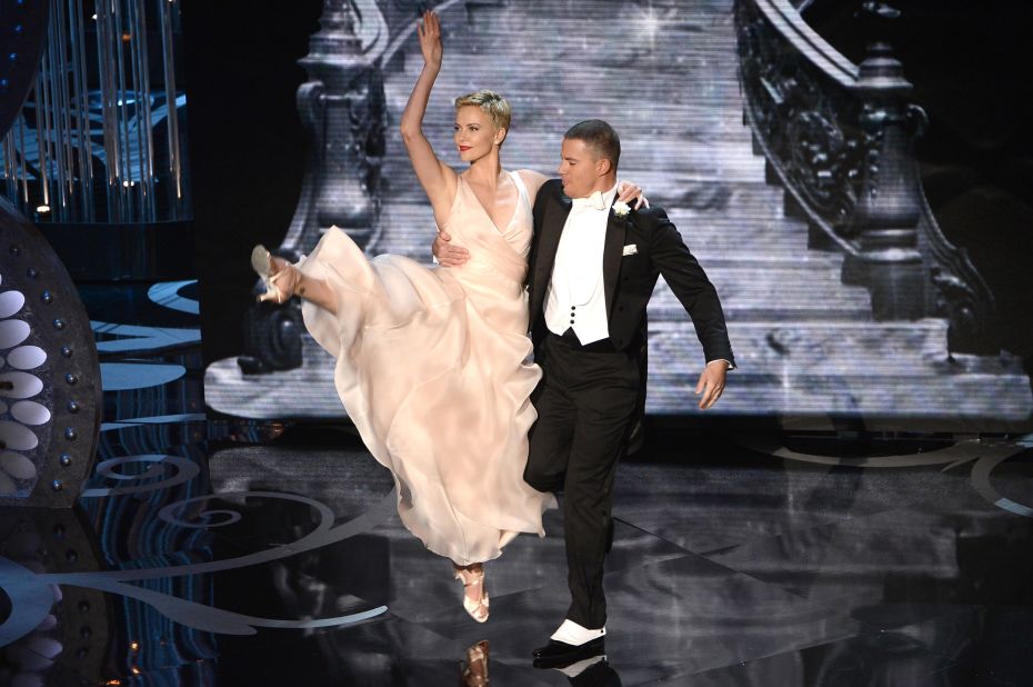 Theron dances with fellow actor Channing Tatum during the the 2013 Academy Awards ceremony held in Hollywood.
