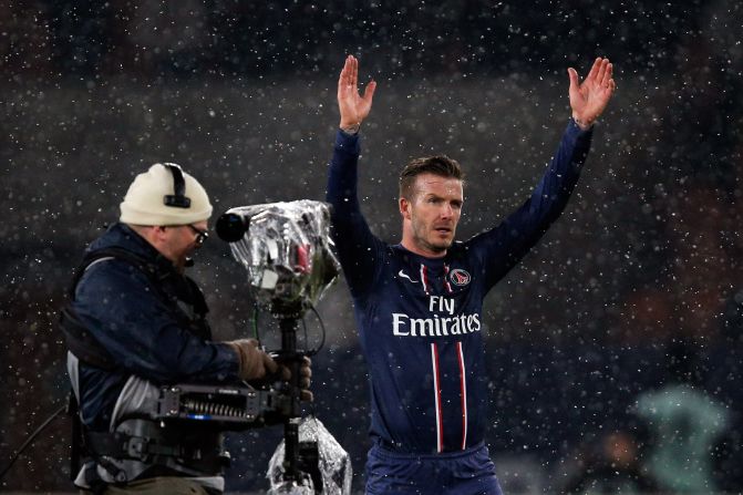 David Beckham acknowledges the crowd after making a winning debut for PSG against Marseille.