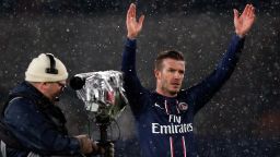 David Beckham acknowledges the crowd after making a winning debut for PSG against Marseille.