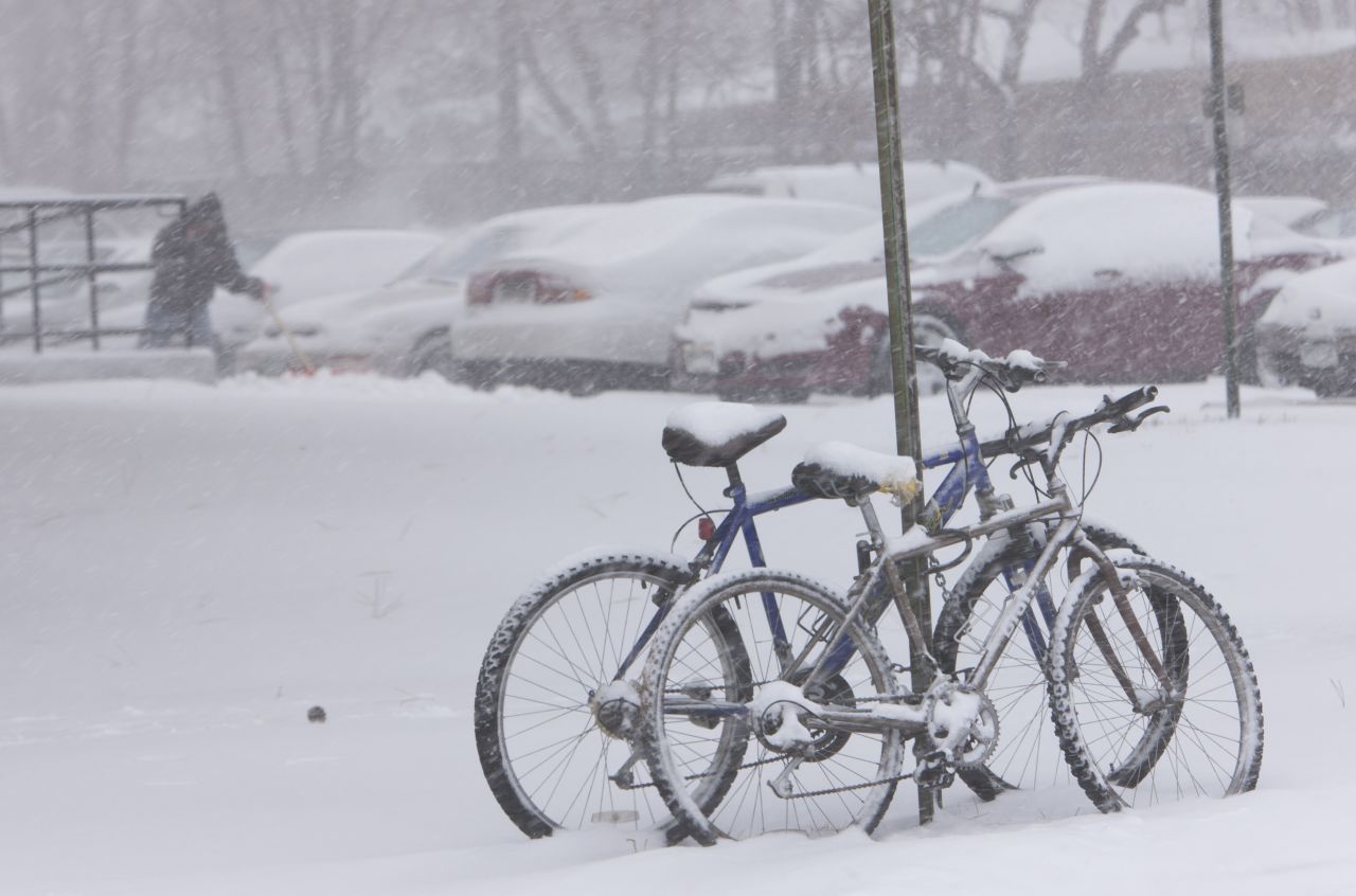 Bicycles gather snow during a storm in Denver on February 24.  
