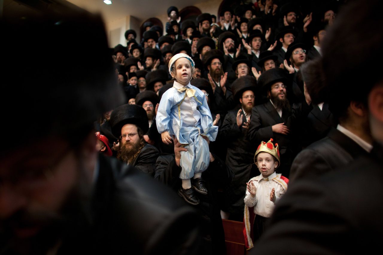 A synagogue in Bnei Brak, Israel, is packed with Ultra-Orthodox Jews celebrating Purim. The carnival-like Purim holiday is celebrated with parades and costume parties.