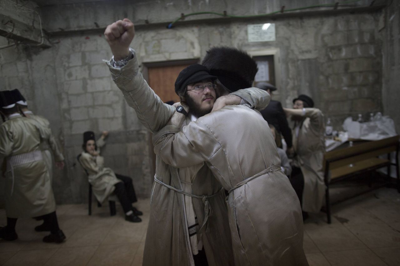 Ultra-Orthodox Jews belonging to the Lelov Hasidic sect, celebrate the Jewish festival of Purim late on February 24 2013 in Beit Shemesh, a religious town near Jerusalem. 
