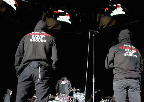 Flea, left, is joined by lead singer Anthony Kiedis in jackets saying "Ode to Trayvon Stand What Ground" while performing March 29. 