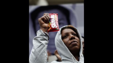 New York City Council Member Letitia James holds a package of Skittles candy while wearing a hoodie on the steps of City Hall in New York on March 28. 