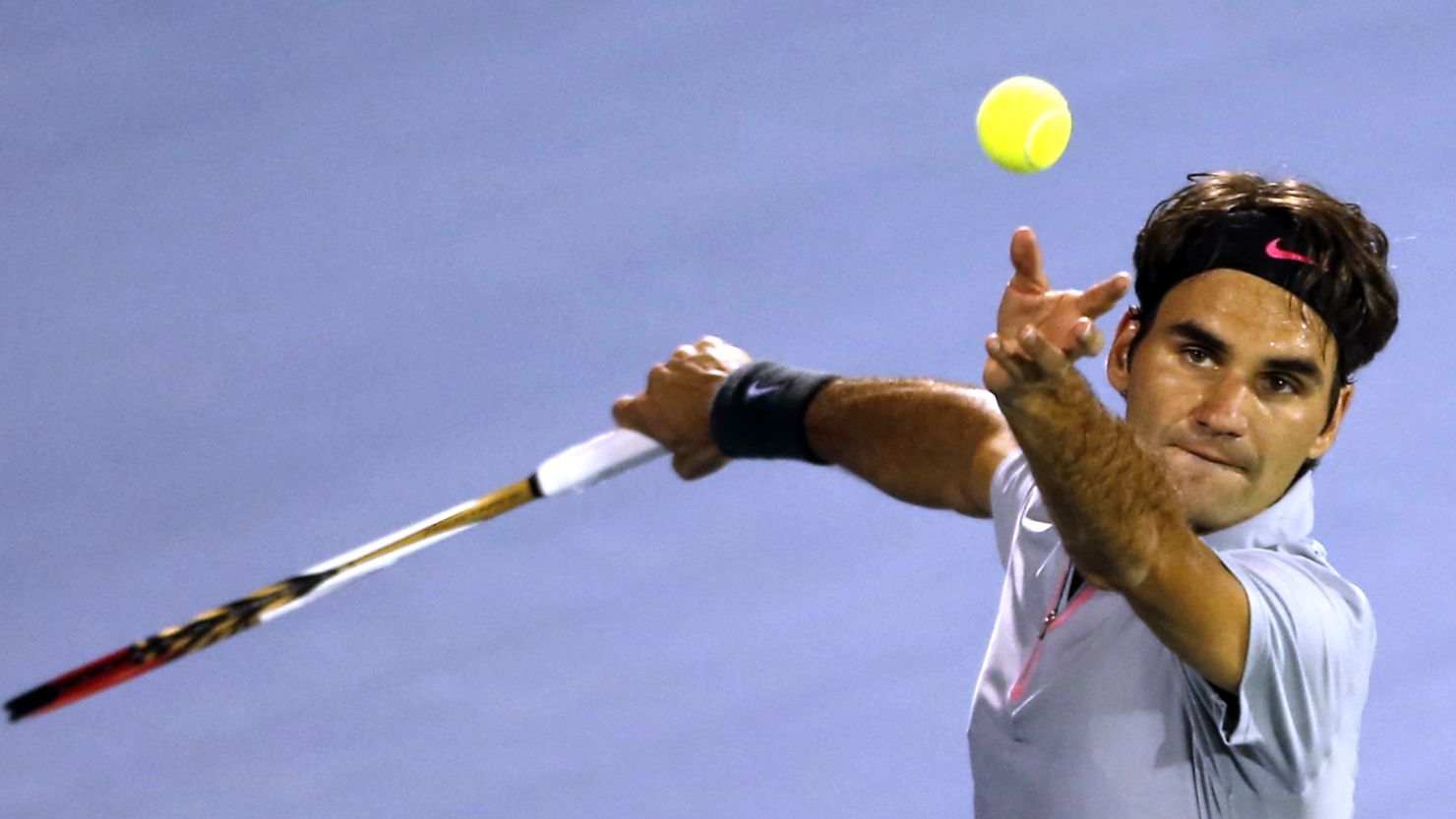 Switzerland's Roger Federer serves against Malek Jaziri as he eyes his sixth Dubai Tennis Championships title