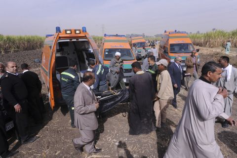 A body gets loaded onto an ambulance.