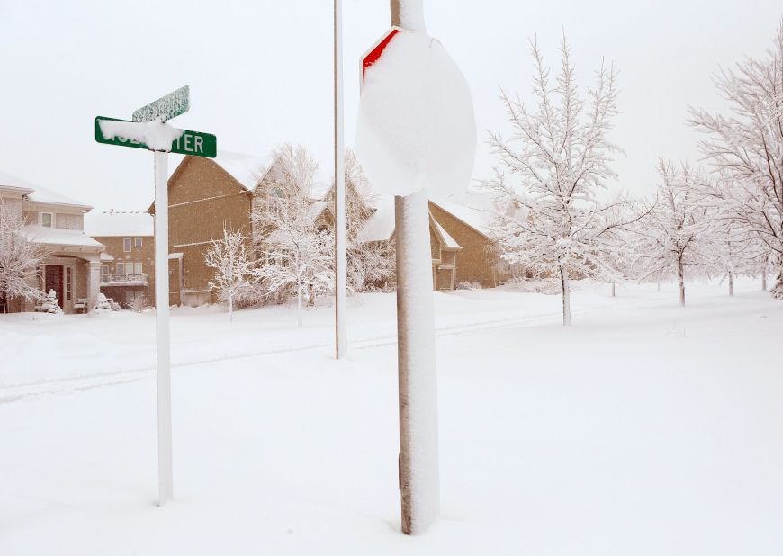 Heavy snow covers street signs in Kansas City, Missouri, on February 26.