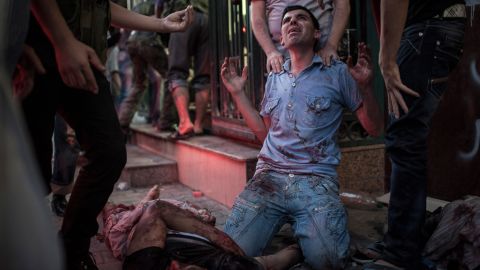 A man mourns  in front of a field hospital on August 21, 2012 in Aleppo.