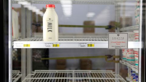 Milk shelves are nearly empty at a Kansas City, Missouri, grocery store on February 26, after a snowstorm batters the area again.