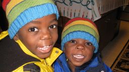 Brothers Zach, right and Philip were born in poverty in Uganda but are now living with their adopted family in the U.S. state of Minnesota.