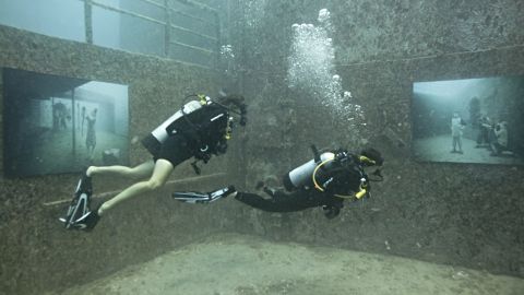 Divers check out the the photo gallery on sunken ship USNS General Hoyt S.Vandenberg, off the coast of Florida.