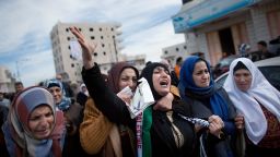 Palestinians mourn during the funeral Arafat Jaradat on February 25, 2013 in the village of Saair in the West Bank. 