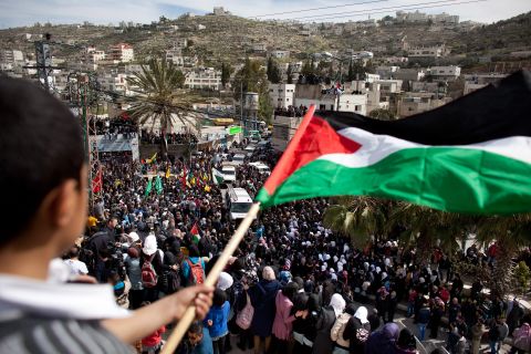 Palestinians take part in the funeral of Arafat Jaradat on February 25, 2013 in the village of Saair in the West Bank.