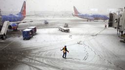 Southwest Airlines employees guide a plane into the gate at Midway International Airport in Chicago on Tuesday, February 26. Back-to-back storms have hit the Great Plains, which is still digging out from last week's weather. Are you experiencing the storm? If it's safe, share your photos.