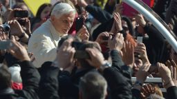 Pope Benedict XVI waves as he arrives on St Peter's square for his last weekly audience on February 27, 2013 at the Vatican. Pope Benedict XVI will hold the last audience of his pontificate in St Peter's Square on Wednesday on the eve of his historic resignation
