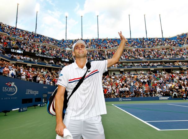American Andy Roddick waves to the crowd as he walks off court after losing to Del Potro of Argentina during their men's singles fourth round match at the 2012 U.S. Open. He announced his retirement after the match.