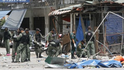Police inspect the site of a bomb blast detonated by suspected militants in Pattani town on February 17, 2013.