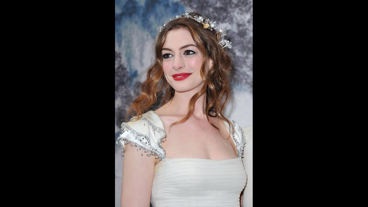 Hathaway dresses like a fairy at the White Fairy Tale Love Ball in support of the <a href="http://www.nakedheart.org/en/" target="_blank" target="_blank">Naked Heart Foundation</a> in July 2011 in Crespieres, France. The charity seeks to build playgrounds for children in Russia.