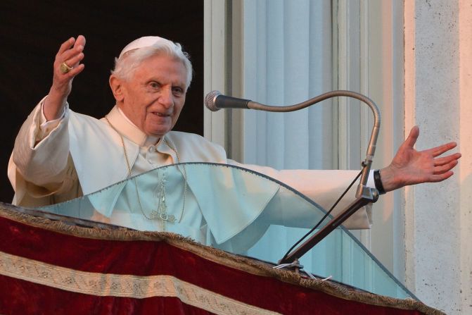 Pope Benedict XVI waves to the crowd from a balcony upon his arrival in Castel Gandolfo.