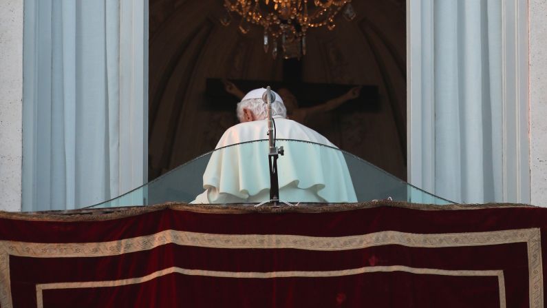 Pope Benedict XVI walks away from the window at Castel Gandolfo for the last time as head of the Catholic Church. He started his retirement February 28.