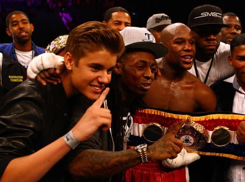 Bieber makes his bread and butter as a teen pop phenom, but his social circle is wide. His <a href="http://sportsillustrated.cnn.com/multimedia/photo_gallery/1205/floyd-mayweather-justin-bieber/content.1.html">appearance as part of boxer Floyd Mayweather Jr.'s entourage</a> at a fight in May 2012 had everyone doing a double take. Lil Wayne and 50 Cent were also on hand.