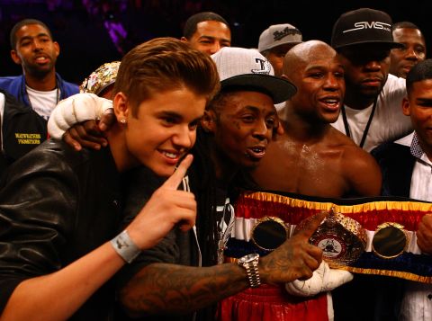 Bieber makes his bread and butter as a teen pop phenom, but his social circle spreads far beyond. His <a href="http://sportsillustrated.cnn.com/multimedia/photo_gallery/1205/floyd-mayweather-justin-bieber/content.1.html">appearance as part of boxer Floyd Mayweather Jr.'s entourage</a> at a fight in May 2012 had everyone do a double take. Lil Wayne and 50 Cent were also on hand.