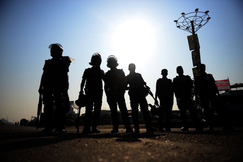 Bangladeshi police personnel stand guard during a nationwide strike in Dhaka on February 24.