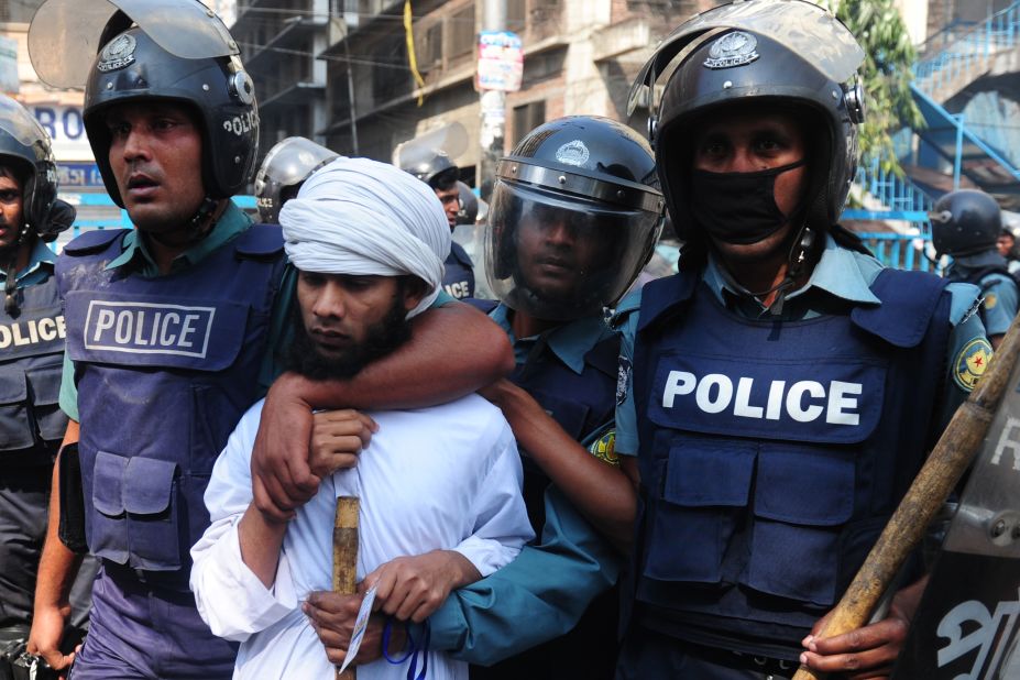 Bangladeshi police detain an Islamist activist during clashes in Dhaka on February 22.
