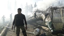 Members of the Free Syrian Army inspect the wreckage of a helicopter, belonging to forces loyal to Syrian President Bashar al-Assad in Aleppo on Saturday, March 2.