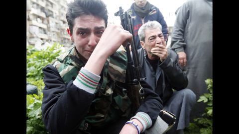 A member of the Free Syrian Army reacts to the death of a comrade who was killed in fighting, at Bustan al Qasr cemetery in Aleppo on Friday, March 1.