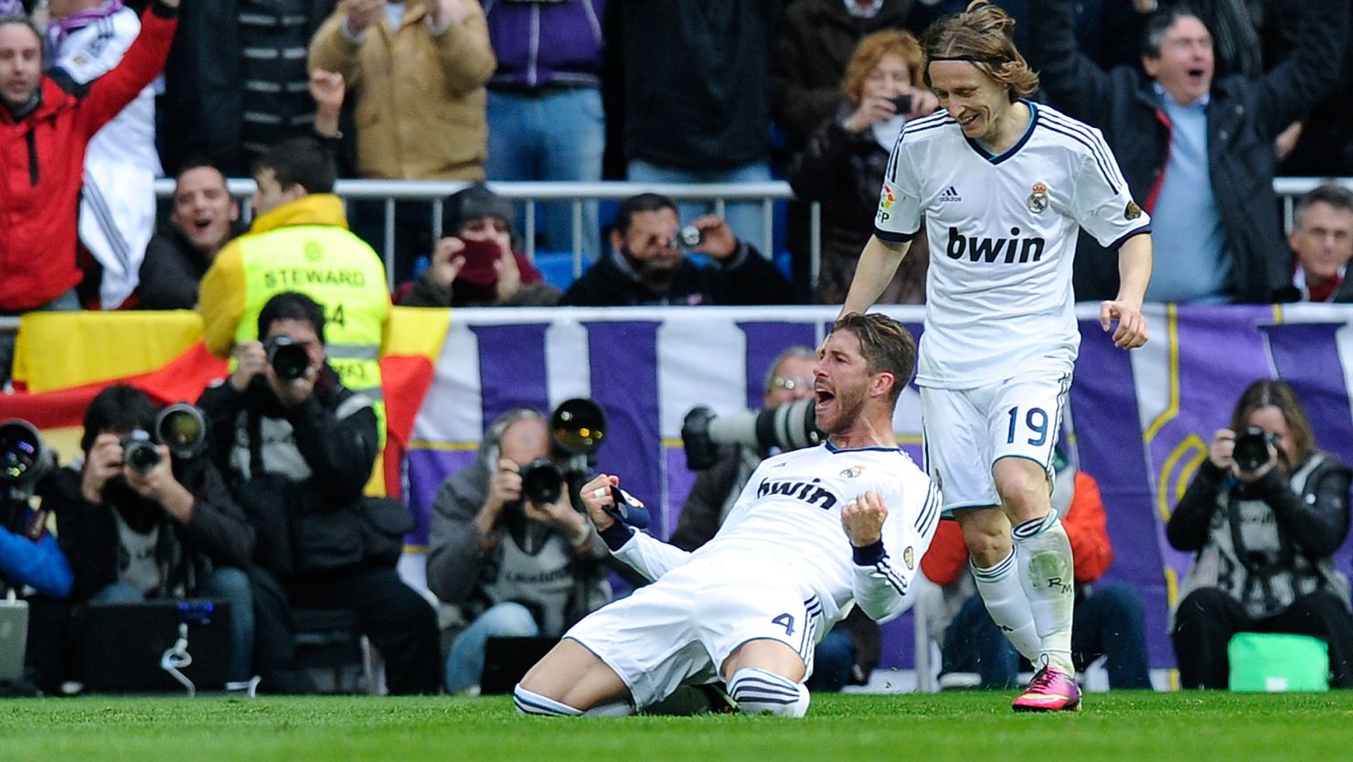 Sergio Ramos (left) celebrates with Luka Modric after scoring Real Madrid's second goal against Barcelona on Saturday.
