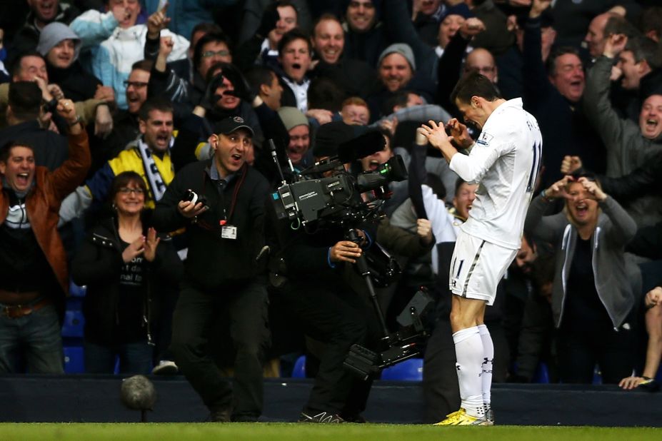 Gareth Bale poses in front of the television cameras after firing Tottenham into a 1-0 lead against arch rival Arsenal at White Hart Lane. The Welshman beat the offside trap before coolly slotting the ball into the net, leaving him free to produce his trademark heart shape celebration.