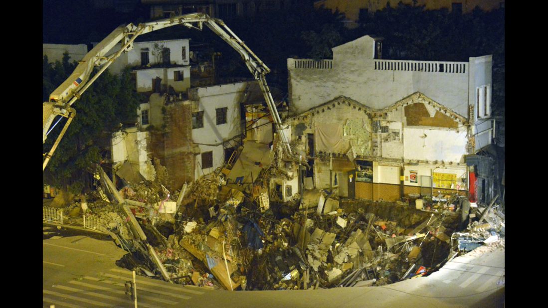 Buildings fell into a sinkhole near a subway construction site in Guangzhou, China, in January 2013. The hole measured about 1,000 square feet across and 30 feet deep and was without casualties, according to a state media report.