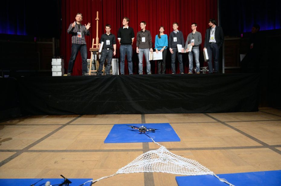 D'Andrea advises a small group of grad students at ETH Zurich. Together they are creating ever more complex tasks for their fleet of quadrocopters. Here the group can be seen onstage during a presentation at a <a href="http://zurichminds.com/" target="_blank" target="_blank">Zurich Minds</a> event last year. 