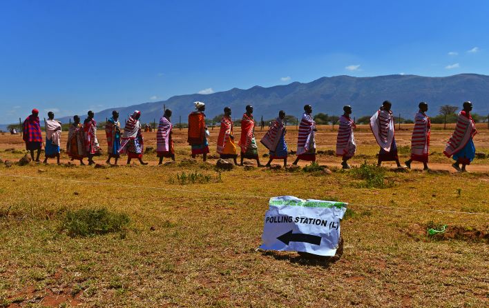 Maasai tribes-people leave after voting in Ilngarooj, Kajiado South County, Maasailand, on March 4, 2013 during Kenya's elections.