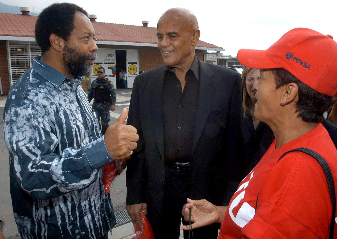 In 2006, singer Harry Belafonte appeared in Venezuela with then-President Hugo Chavez and made controversial statements about Bush: "No matter what the greatest tyrant in the world, the greatest terrorist in the world, George W. Bush says, we're here to tell you: Not hundreds, not thousands, but millions of the American people support your revolution." In this photo, Belafonte, center, speaks with residents of a low-income neighborhood in Caracas, Venezuela, before meeting Chavez in January 2005.