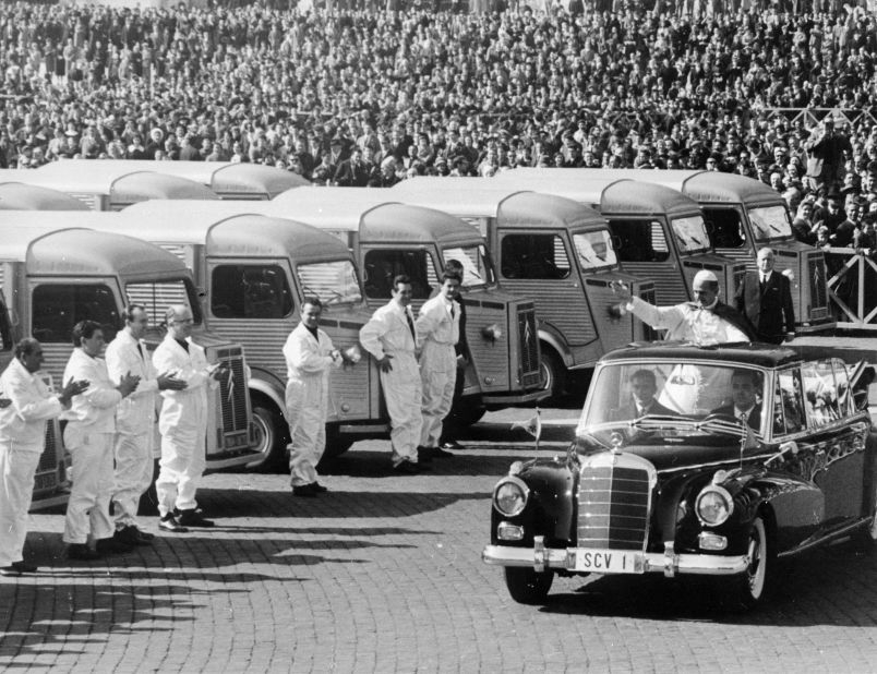 1966: Pope Paul VI blesses lorries from the back of a Mercedes-Benz in St. Peter's Square, Rome, before they are shipped to famine-stricken areas of India.