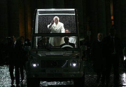 Pope Benedict XVI waves as he arrives in St. Peter's Square after leading the Te Deum prayer on December 31, 2009 in Vatican City, Vatican. The lights inside the Popemobile enable the crowds to see inside the vehicle.