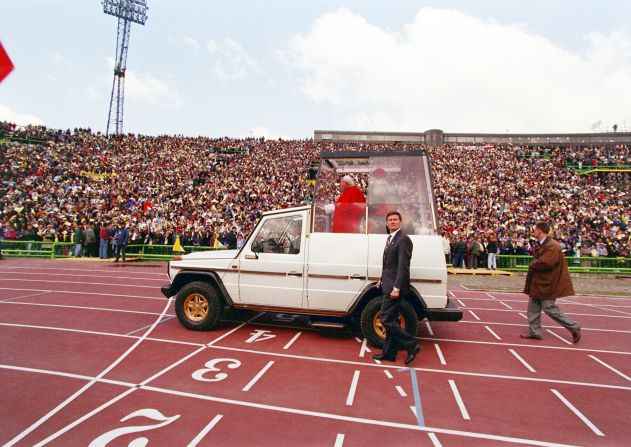 In this version of the Popemobile, Pope John Paul II arrives at Sarajevo stadium on April 13, 1997.